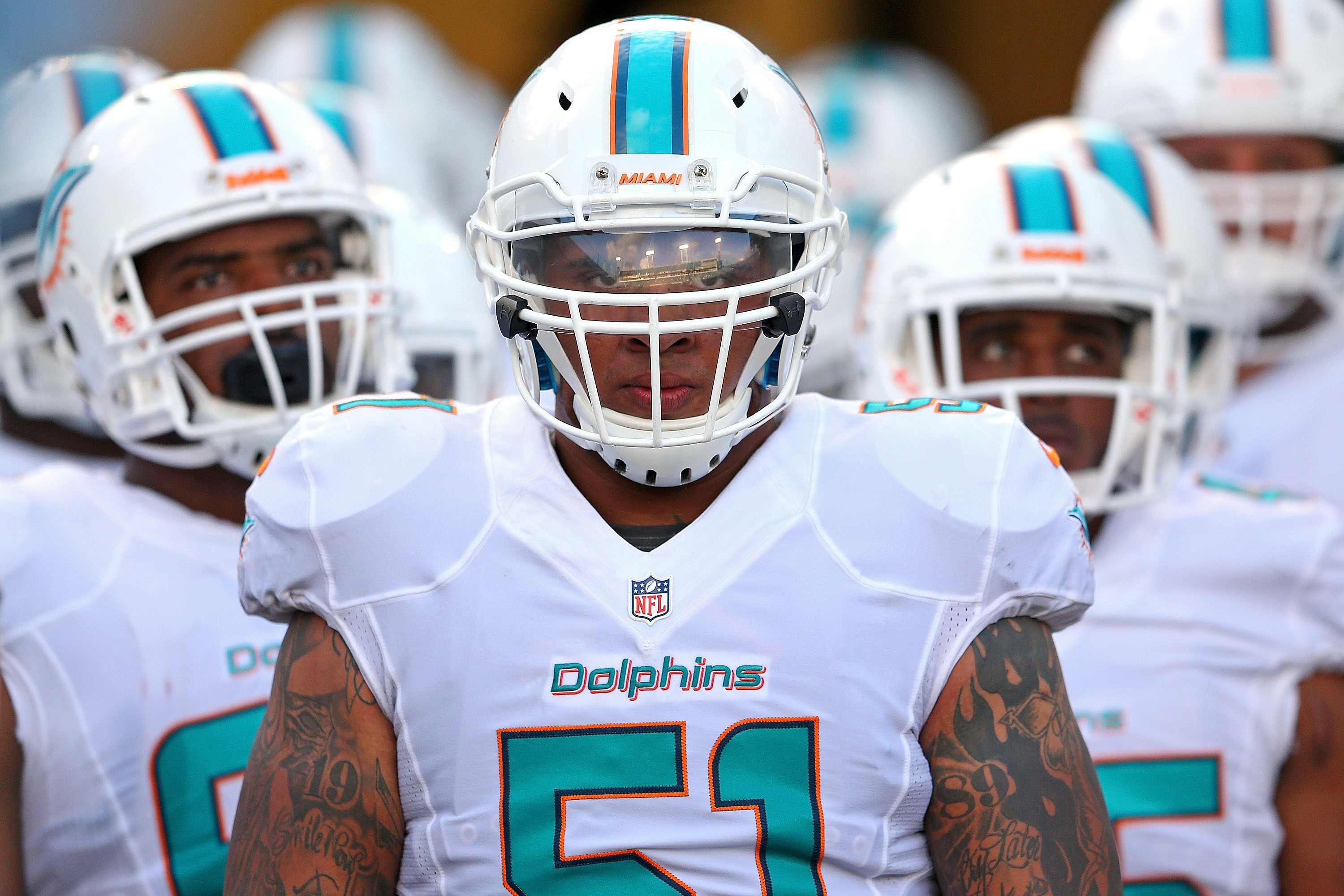 Center Mike Pouncey of the Miami Dolphins signals at the line of