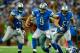 Oct 27, 2013; Detroit, MI, USA; Detroit Lions quarterback Matthew Stafford (9) runs out of the pocket during the third quarter against the Dallas Cowboys at Ford Field. Mandatory Credit: Andrew Weber-USA TODAY Sports