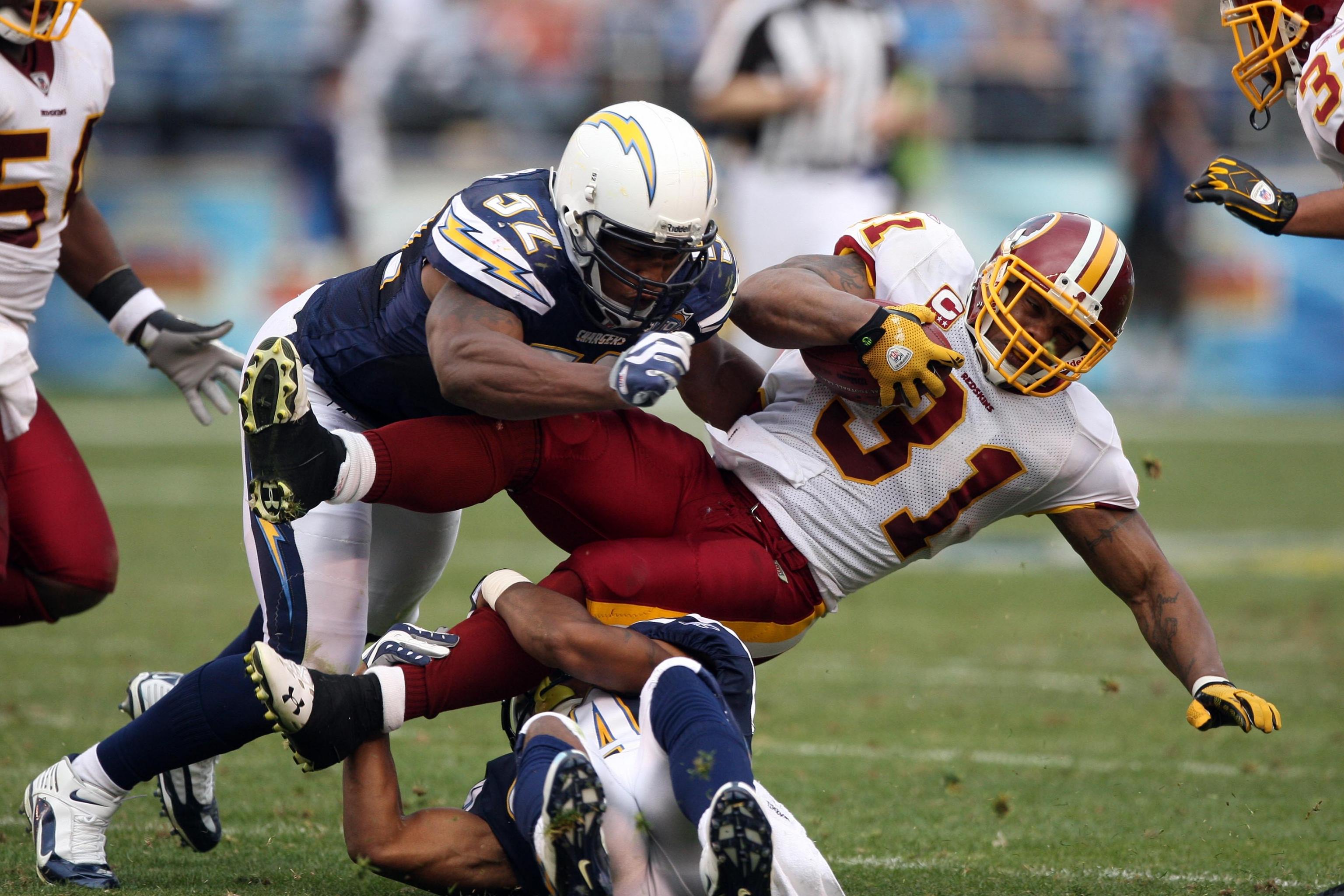 Washington Redskins Rock Cartwright (31) is tackled by New York