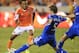 Oct 4, 2013; Houston, TX, USA; Houston Dynamo midfielder Ricardo Clark (13) dribbles against Montreal Impact midfielder Jeb Brovsky (5) during the second half at BBVA Compass Stadium. The Dynamo won 1-0. Mandatory Credit: Thomas Campbell-USA TODAY Sports