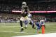 Oct 27, 2013; New Orleans, LA, USA; New Orleans Saints wide receiver Kenny Stills (84) carries the ball into the end zone for a touchdown in the second quarter agains the Buffalo Bills at Mercedes-Benz Superdome. Mandatory Credit: Crystal LoGiudice-USA TODAY Sports