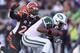 CINCINNATI, OH - OCTOBER 27: Geno Smith #7 of the New York Jetsis sacked by Reggie Nelson #20 of the Cincinnati Bengals during the game at Paul Brown Stadium on October 27, 2013 in Cincinnati, Ohio. (Photo by Andy Lyons/Getty Images)
