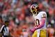 Oct 27, 2013; Denver, CO, USA; Washington Redskins quarterback Robert Griffin III (10) leaves the field after an interception thrown to Denver Broncos free safety Rahim Moore (26) (not pictured )in the fourth quarter at Sports Authority Field at Mile High. Mandatory Credit: Ron Chenoy-USA TODAY Sports