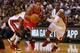 MIAMI, FL - OCTOBER 29: Derrick Rose #1 of the Chicago Bulls drives to the basket past Mario Chalmers #15 of the Miami Heat during a game at American Airlines Arena on October 29, 2013 in Miami, Florida. (Photo by Mike Ehrmann/Getty Images)