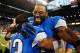 Oct 27, 2013; Detroit, MI, USA; Detroit Lions wide receiver Calvin Johnson (81) celebrates with cornerback Chris Houston (23) after defeating the Dallas Cowboys 31-30 at Ford Field. Mandatory Credit: Andrew Weber-USA TODAY Sports