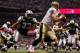 NEW ORLEANS - OCTOBER 04: Drew Brees #9 of the New Orleans Saints avoids a tackle by Eric Smith #33 of the New York Jets at the Louisana Superdome on October 4, 2009 in New Orleans, Louisiana. (Photo by Chris Graythen/Getty Images)