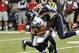 Oct 28, 2013; St. Louis, MO, USA; St. Louis Rams defensive end Robert Quinn (94) sacks Seattle Seahawks quarterback Russell Wilson (3) during the first half at Edward Jones Dome. Mandatory Credit: Jasen Vinlove-USA TODAY Sports