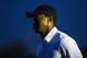 Oct 6, 2013; Dublin, OH, USA; Tiger Woods warms up on the practice range before the restart of the third round of the Presidents Cup at Muirfield Village Golf Club. Mandatory Credit: Allan Henry-USA TODAY Sports