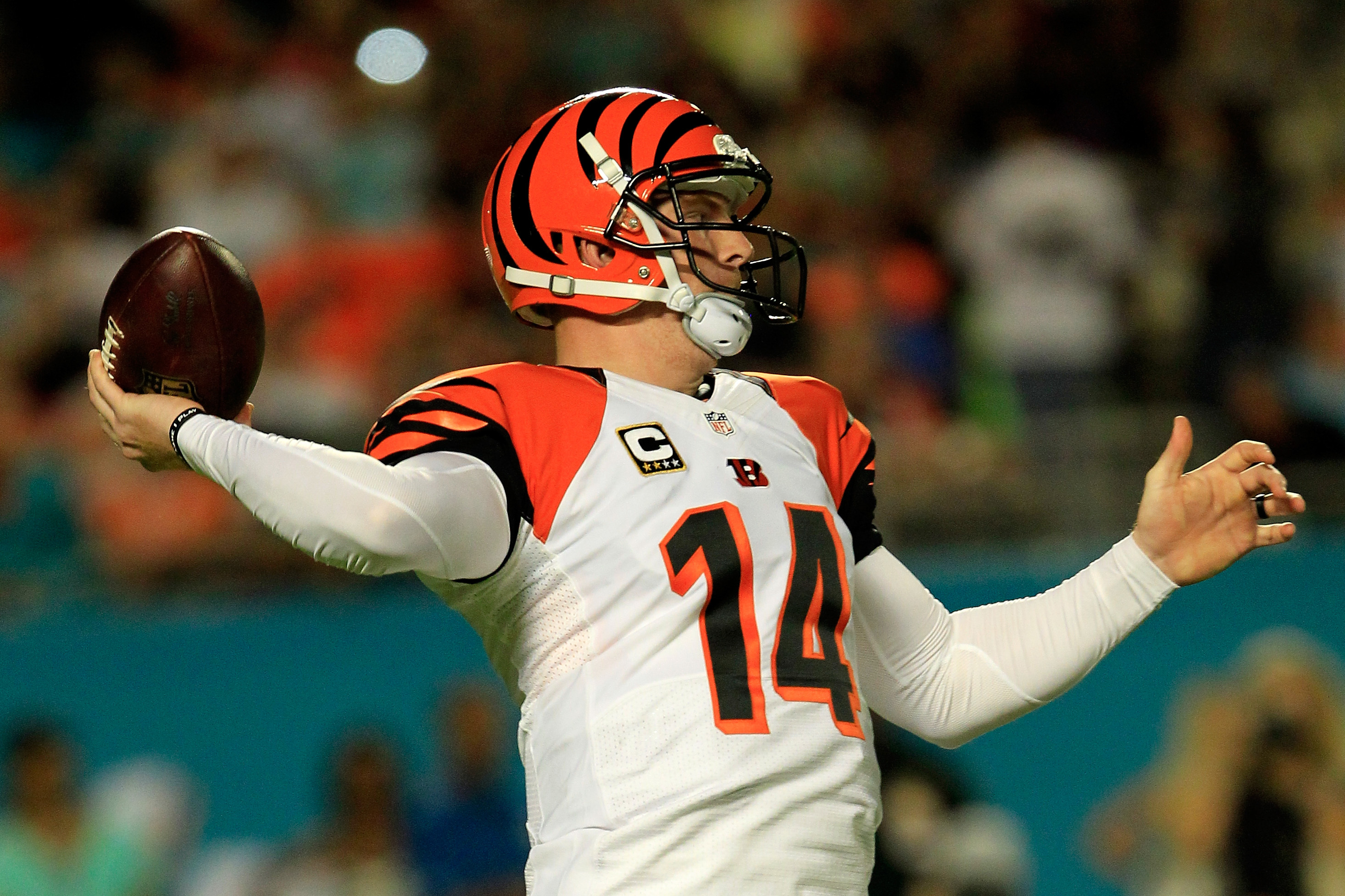 Cincinnati Bengals quarterback Andy Dalton (14) walks off the