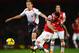 LONDON, ENGLAND - NOVEMBER 02: Lucas Leiva of Liverpool and Santi Cazorla of Arsenal battle for the ball during the Barclays Premier League match between Arsenal and Liverpool at Emirates Stadium on November 2, 2013 in London, England. (Photo by Laurence Griffiths/Getty Images)
