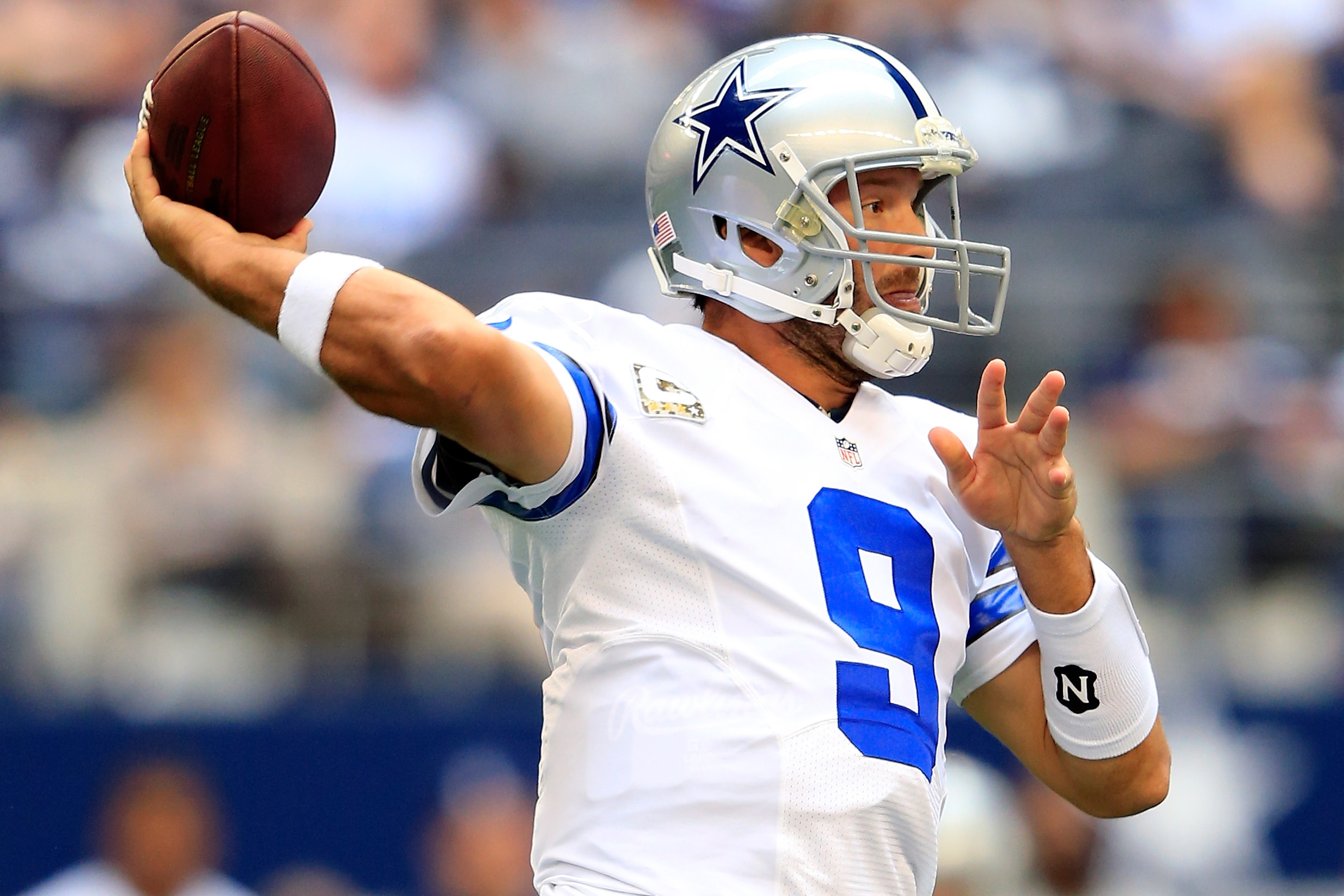 Dallas Cowboys quarterback Tony Romo throws a ball during a