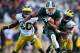 Nov 2, 2013; East Lansing, MI, USA; Michigan State Spartans wide receiver Bennie Fowler (13) runs for yards after the catch against Michigan Wolverines defensive back Raymon Taylor (6) during the 2nd half of a game at Spartan Stadium. MSU won 29-6. Mandatory Credit: Mike Carter-USA TODAY Sports