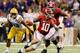 NEW ORLEANS, LA - JANUARY 09: AJ McCarron #10 of the Alabama Crimson Tide runs with the ball against the Louisiana State University Tigers during the 2012 Allstate BCS National Championship Game at Mercedes-Benz Superdome on January 9, 2012 in New Orleans, Louisiana. (Photo by Ronald Martinez/Getty Images)