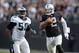Nov 3, 2013; Oakland, CA, USA; Oakland Raiders quarterback Terrelle Pryor (2) is pursued by Philadelphia Eagles linebacker DeMeco Ryans (59) on a 35-yard gain in the first half at O.co Coliseum. Mandatory Credit: Kirby Lee-USA TODAY Sports