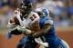 DETROIT, MI - SEPTEMBER 29: Matt Forte #22 of the Chicago Bears tries to escape the tackle of Stephen Tulloch #55 of the Detroit Lions during the fourth quarter at Ford Field on September 29, 2013 in Detroit, Michigan. Detroit won the game 40-32. (Photo by Gregory Shamus/Getty Images)