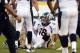 Nov 10, 2013; San Diego, CA, USA; Denver Broncos quarterback Peyton Manning (18) sits on the turf after injuring his leg during a pass play in the closing minutes of the Broncos win over the San Diego Chargers at Qualcomm Stadium. Manning did not leave the game. Mandatory Credit: Robert Hanashiro-USA TODAY Sports