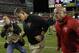 Oct 24, 2013; Tampa, FL, USA; Tampa Bay Buccaneers head coach Greg Schiano runs off the field after the loss to the Carolina Panthers at Raymond James Stadium. Carolina Panthers defeated the Tampa Bay Buccaneers 31-13. Mandatory Credit: Kim Klement-USA TODAY Sports