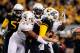 Nov 9, 2013; Morgantown, WV, USA; Texas Longhorns defensive end Jackson Jeffcoat (44) records a sack and forced fumble on West Virginia Mountaineers quarterback Paul Millard (14) at Milan Puskar Stadium. Mandatory Credit: Evan Habeeb-USA TODAY Sports
