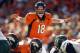 Nov 10, 2013; San Diego, CA, USA; Denver Broncos quarterback Peyton Manning (18) calls a play at the line of scrimmage during the closing minute in the Broncos win over the San Diego Chargers at Qualcomm Stadium. Mandatory Credit: Robert Hanashiro-USA TODAY Sports