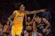 Nov 12, 2013; Los Angeles, CA, USA; Los Angeles Lakers forward Jordan Hill (27) celebrates as New Orleans Pelicans guard Eric Gordon (10) watches at Staples Center. The Lakers defeated the Pelicans 116-95. Mandatory Credit: Kirby Lee-USA TODAY Sports