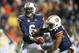 AUBURN, AL - OCTOBER 26: Quarterback Jeremy Johnson #6 of the Auburn Tigers hands the ball off to quarterback Nick Marshall #14 of the Auburn Tigers during their game against the Florida Atlantic Owls on October 26, 2013 at Jordan-Hare Stadium in Auburn, Alabama. Auburn defeated Florida Atlantic 45-10. (Photo by Michael Chang/Getty Images)