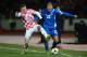 REYKJAVIK, ICELAND - NOVEMBER 15: Eiour Smari Guojohnson of Iceland battles with Ivica Olic of Croatia during the FIFA 2014 World Cup Qualifier Play-off First Leg match between Iceland and Croatia at the Laugardalsvollur stadium on November 15, 2013 in Reykjavik, Iceland. (Photo by Jamie McDonald/Getty Images)