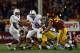 LOS ANGELES, CA - NOVEMBER 16: Quarterback Kevin Hogan #8 of the Stanford Cardinal is brought down by linebacker Hayes Pullard #10 of the USC Trojans, as defensive end J.R. Tavai #58 of the Trojans pursues the play in the fourth quarter at Los Angeles Coliseum on November 16, 2013 in Los Angeles, California. USC defeated Stanford 20-17. (Photo by Jeff Gross/Getty Images)