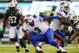 EAST RUTHERFORD, NJ - SEPTEMBER 22: Quarterback EJ Manuel #3 of the Buffalo Bills is caught from behind by linebacker Antwan Barnes #95 of the New York Jets during the second quarter in a game at MetLife Stadium on September 22, 2013 in East Rutherford, New Jersey. (Photo by Rich Schultz /Getty Images)