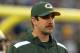 Nov 17, 2013; East Rutherford, NJ, USA; Green Bay Packers injured quarterback Aaron Rodgers (12) before the start of a game against the New York Giants at MetLife Stadium. Mandatory Credit: Brad Penner-USA TODAY Sports
