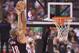 Nov 17, 2013; Toronto, Ontario, CAN; Portland Trail Blazers small forward Nicolas Batum (88) shoots the ball over Toronto Raptors center Jonas Valanciunas (17) during game at the Air Canada Centre. Portland won the game 118-110. Mandatory Credit: Mark Konezny-USA TODAY Sports