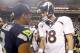 Aug 17, 2013; Seattle, WA, USA; Seattle Seahawks quarterback Russell Wilson (3) and Denver Broncos quarterback Peyton Manning (18) speak following a 40-10 preseason victory by the Seahawks at CenturyLink Field. Mandatory Credit: Joe Nicholson-USA TODAY Sports