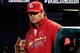Cardinals' manager Mike Matheny stands at the top step of the dugout during Game Three of the 2013 World Series.