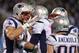 Nov 18, 2013; Charlotte, NC, USA; New England Patriots tight end Rob Gronkowski (87) celebrates with quarterback Tom Brady (12) and wide receiver Danny Amendola (80) after scoring a touchdown in the third quarter. The Panthers defeated the Patriots 24-20 at Bank of America Stadium. Mandatory Credit: Bob Donnan-USA TODAY Sports