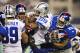 ARLINGTON, TX - SEPTEMBER 8: DeMarco Murray #29 of the Dallas Cowboys is gang tackled by a group of New York Giants at AT&T Stadium on September 8, 2013 in Arlington, Texas. The Cowboys defeated the Giants 31-36. (Photo by Wesley Hitt/Getty Images)