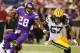 MINNEAPOLIS, MN - OCTOBER 27: Adrian Peterson #28 of the Minnesota Vikings gets pulled down while Jamari Lattimore #57 of the Green Bay Packers provides backup on October 27, 2013 at Mall of America Field at the Hubert Humphrey Metrodome in Minneapolis, Minnesota. (Photo by Adam Bettcher/Getty Images)