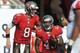 TAMPA, FL - NOVEMBER 17: Quarterback Mike Glennon #8 of the Tampa Bay Buccaneers celebrates after a touchdown run by running back Bobby Rainey #43 against the Atlanta Falcons November 17, 2013 at Raymond James Stadium in Tampa, Florida. The Bucs won 41 - 28. (Photo by Al Messerschmidt/Getty Images)