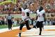 Nov 16, 2013; Austin, TX, USA; Oklahoma State Cowboys quarterback Clint Chelf (10) and fulback Desmond Roland (9) celebrate after a touchdown against the Texas Longhorns during the first quarter at Darrell K Royal-Texas Memorial Stadium. Mandatory Credit: Brendan Maloney-USA TODAY Sports