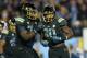Nov 15, 2013; Pasadena, CA, USA; UCLA Bruins running back Myles Jack (30) celebrates with offensive lineman Caleb Benenoch (74) after scoring on a 2-yard touchdown run in the third quarter for his fourth touchdown against the Washington Huskies at Rose Bowl. Mandatory Credit: Kirby Lee-USA TODAY Sports