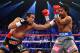 LAS VEGAS, NV - DECEMBER 08: (L-R) Juan Manuel Marquez throws a left to the face of Manny Pacquiao during their welterweight bout at the MGM Grand Garden Arena on December 8, 2012 in Las Vegas, Nevada. (Photo by Al Bello/Getty Images)
