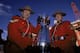 26 Nov 2000: A view of two Mounties posing with the Grey Cup before the Grey Cup 2000 game between the British Columbia Lions and the Montreal Alouettes at the McMahon Stadium in Calgary, Alberta, Canada. The Lions defeated the Alouettes 28-26. Mandatory Credit: Craig Klem /Allsport