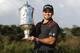 MELBOURNE, AUSTRALIA - NOVEMBER 24: Jason Day of Australia poses with the trophy after winning the tournament during day four of the World Cup of Golf at Royal Melbourne Golf Course on November 24, 2013 in Melbourne, Australia. (Photo by Robert Prezioso/Getty Images)