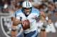 Nov 24, 2013; Oakland, CA, USA; Tennessee Titans quarterback Ryan Fitzpatrick (4) runs with the ball against the Oakland Raiders at O.co Coliseum. Mandatory Credit: Kirby Lee-USA TODAY Sports
