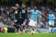 MANCHESTER, ENGLAND - NOVEMBER 24: Erik Lamela of Tottenham Hotspur challenges Fernandinho of Manchester City during the Barclays Premier League match between Manchester City and Tottenham Hotspur at Etihad Stadium on November 24, 2013 in Manchester, England. (Photo by Jamie McDonald/Getty Images)