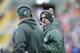 GREEN BAY, WI - NOVEMBER 24: Aaron Rodgers of the Green Bay Packers talks with head coach Mike McCarthy from the sidelines against the Minnesota Vikings defense at Lambeau Field on November 24, 2013 in Green Bay, Wisconsin. (Photo Tom Lynn /Getty Images)