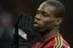 MILAN, ITALY - NOVEMBER 23: Mario Balotelli of AC Milan dejected during the Serie A match between AC Milan and Genoa CFC at Stadio Giuseppe Meazza on November 23, 2013 in Milan, Italy. (Photo by Claudio Villa/Getty Images)