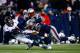 FOXBORO, MA - NOVEMBER 24: Tight end Jacob Tamme #84 of the Denver Broncos makes a catch in overtime as he is tackled by outside linebacker Jamie Collins #91 of the New England Patriots during a game at Gillette Stadium on November 24, 2013 in Foxboro, Massachusetts. (Photo by Jared Wickerham/Getty Images)
