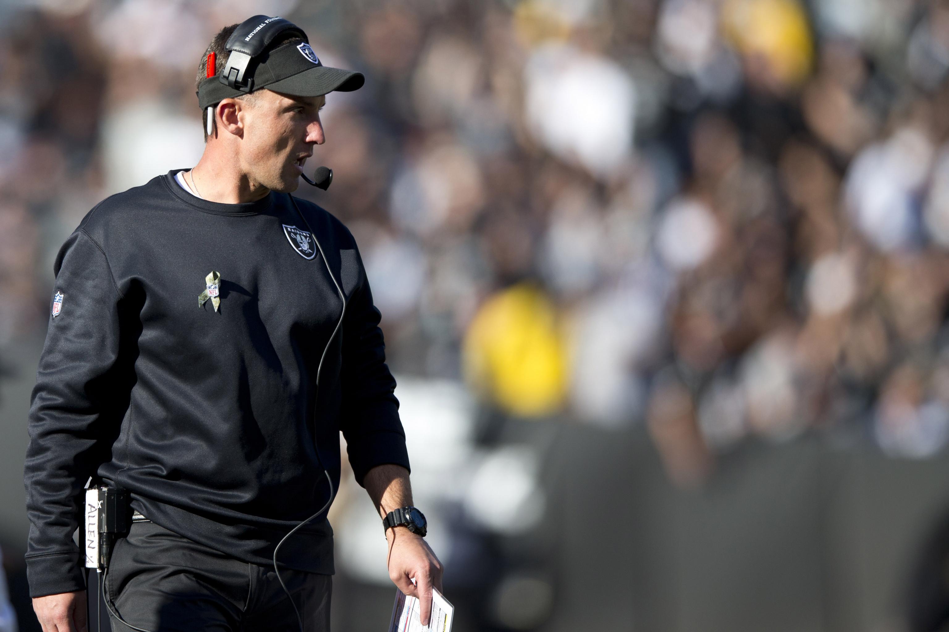 Oakland Raiders' head coach Dennis Allen looks at the replay screen in  their game against the Seattle Seahawks at CenturyLink Field in Seattle,  Washington on August 30, 2012. The Seahawks beat the