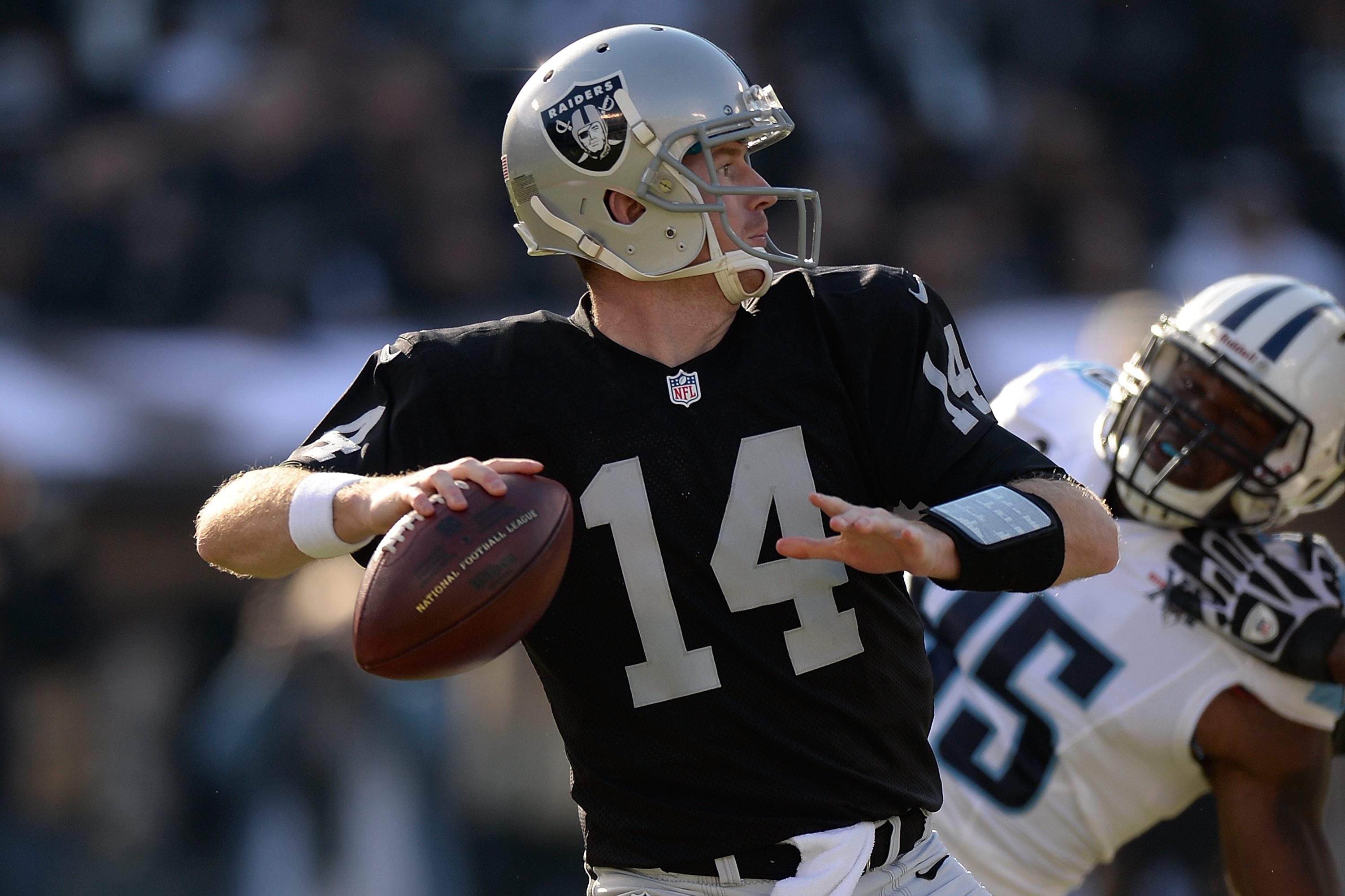 Oakland Raiders quarterback Rich Gannon looks up after he was sacked by the  New England Patriot …