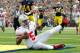 ANN ARBOR, MI - NOVEMBER 26: Braxton Miller #5 of the Ohio State Buckeyes gets in for a second quarter touchdown in front of Desmond Morgan #44 of the Michigan Wolverines at Michigan Stadium on November 26, 2011 in Ann Arbor, Michigan. (Photo by Gregory Shamus/Getty Images)
