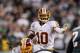 Nov 17, 2013; Philadelphia, PA, USA; Washington Redskins quarterback Robert Griffin III (10) moves players around at the line of scrimmage during the fourth quarter against the Philadelphia Eagles at Lincoln Financial Field. The Eagles defeated the Redskins 24-16. Mandatory Credit: Howard Smith-USA TODAY Sports